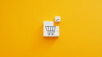 Shopping cart made of blocks. Marketing and retail strategy.