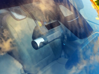 Car dash camera on windshield – modern vehicle security device