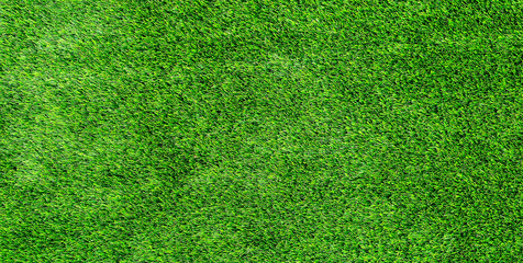 Artificial grass texture background with bright green synthetic turf and detailed pattern
