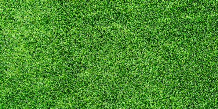 Artificial grass texture background with bright green synthetic turf and detailed pattern