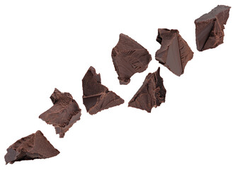 Chunks of crushed dark chocolate fly through space, forming a chain. Isolated on white.