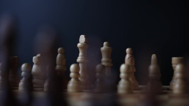 Animated sequence showing chess pieces on revolving board, capturing the essence of strategic decision-making and the black versus white dichotomy in chess