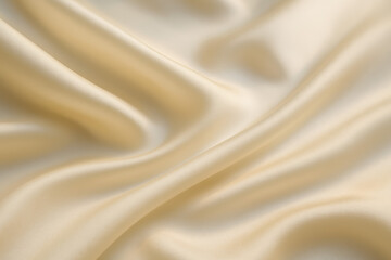 Fototapeta premium Close-up of smooth satin fabric in soft beige color