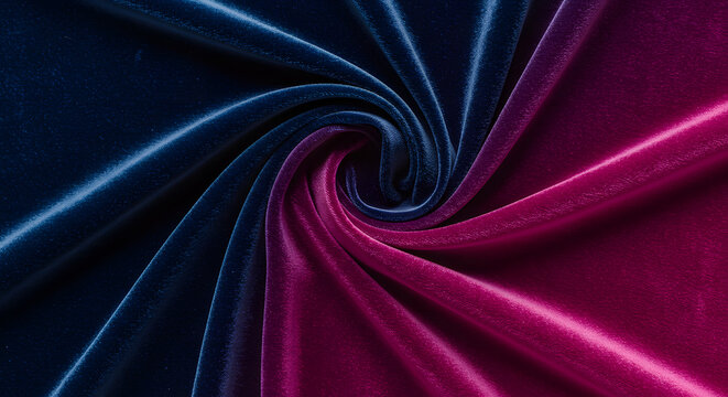A luxurious swirl of deep blue and vibrant pink velvet fabric creating an elegant and rich texture, perfect for fashion, design, and textile projects