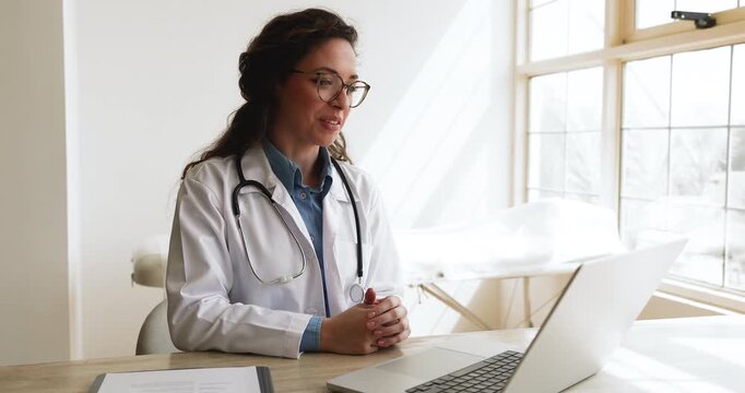 Female general practitioner participating in videocall at clinic office