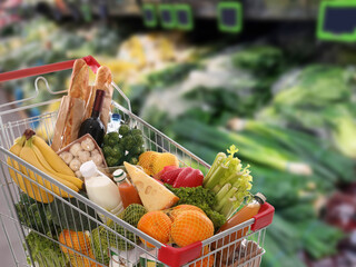 Shopping cart full of products in supermarket © New Africa