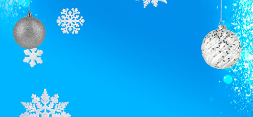 Christmas balls and snowflakes against blue background, banner design. Beautiful festive ornaments