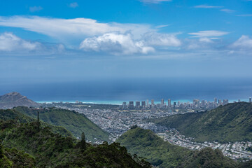 Pālolo Valley with the city skyline of Honolulu. Mauʻumae Ridge Trail (Puʻu Lanipō), Oahu, Hawaii. Koʻolau Range, shield volcano. On the right is Waʻahila Ridge