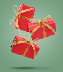 Gift boxes falling on sage color background