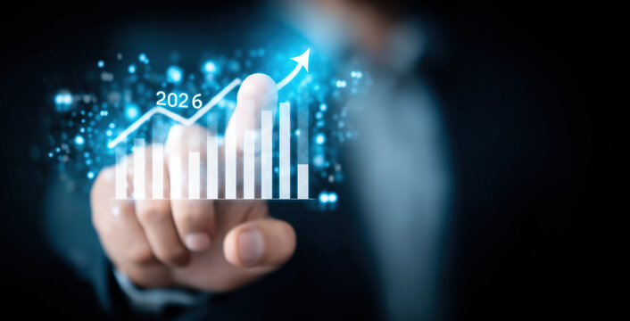 Finger selecting 2026 growth chart displaying upward business performance trends and future projections.
