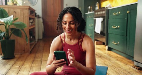 Phone, fitness and woman in home with typing for research, social media or workout routine online. Technology, happy and female person on cellphone for exercise tips on mobile app in apartment.
