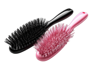 Two oval hairbrushes, black and pink, lie angled on a black background