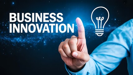 Businessman pointing to the words business innovation next to a glowing lightbulb icon, symbolizing new idea generation and corporate strategy