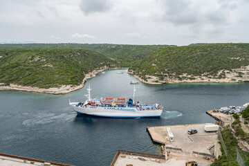 Aerial view marina cape Bonifacio south Corsica France citadel on rocky promontory on wild white limestone cliffs