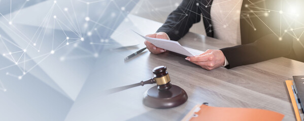 Female lawyer working on document; panoramic banner