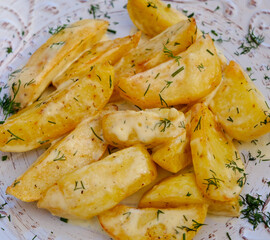 Homemade baked potato wedges, baked potatoes, isolated on white background. High quality photo
