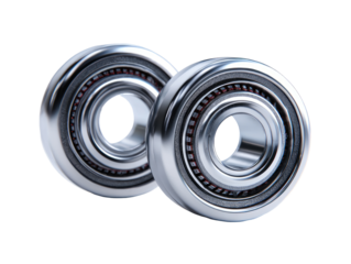 Two highly reflective, metallic circular mechanical components are presented. These objects possess a central opening, with internal dark and reddish-brown details