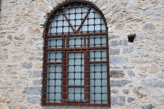 Old window with iron bars in Beykoz Glass and Crystal Museum. Historical building. Istanbul, Turkey.