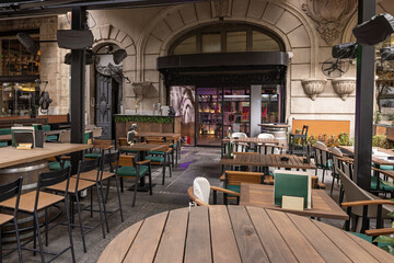 Urban café terrace with greenery and outdoor seating