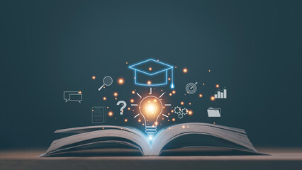 Education knowledge concept. Glowing light bulb with graduation cap emerging from an open book...