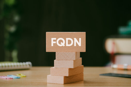 There is wood block with the word FQDN. It is an abbreviation for Fully Qualified Domain Name as eye-catching image.