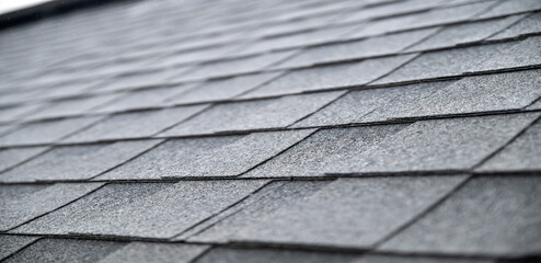 Dark gray asphalt roof shingles texture background