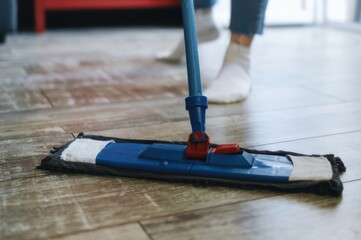 Floor Cleaning: Mop on Wood, Home Hygiene, Close-up View