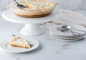 A serving of a delicious custard pie topped with merengue, ready for eating.