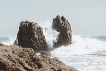 waves crashing on rocks