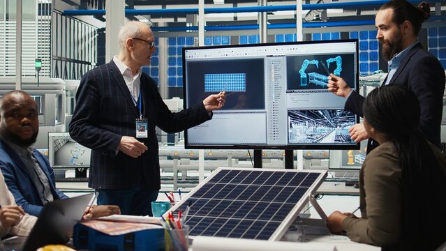 Management executives and investors in photovoltaics plant analyzing market trends to determine investment strategies for expanding solar energy production capabilities, camera A