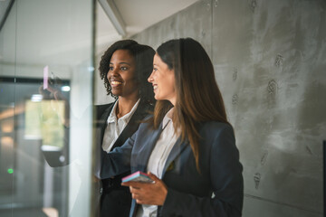 Businesswomen collaborating on ideas during office meeting