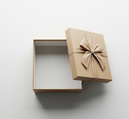 Cadeau ouvert en beige avec un n&oelig;ud sur fond blanc