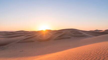 Golden sunset over vast desert dunes creating a serene landscape.