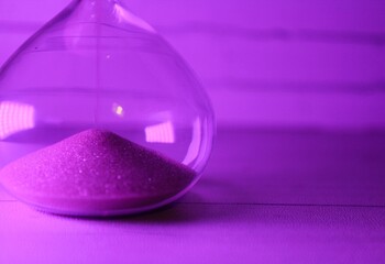 Hourglass as symbol of passing time concept photo	
