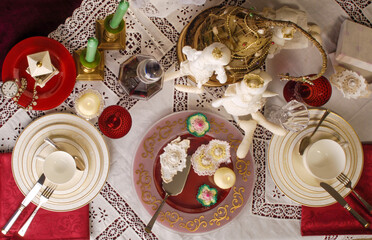 beautifully decorate the table with dishes for a festive New Year's backdrop