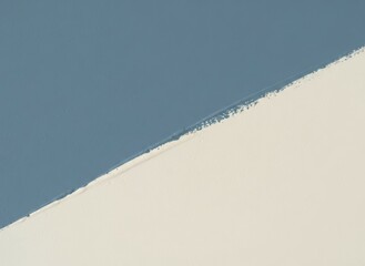 Wall painted blue and white creating diagonal line