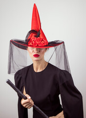 Woman in Halloween silence. Halloween makeup and costume concept. Horror. Photo. Red lips