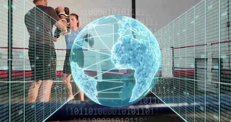 Coach raising mitts while boxer punching, AR globe growing then shrinking over ring for sports - Powered by Adobe