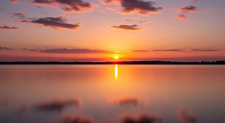 Obraz premium Serene Sunset Over Calm Water with Colorful Clouds