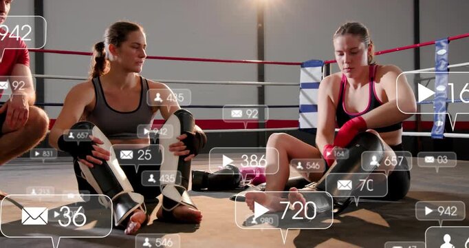 Boxers adjusting guards and wraps in ring preparing for training  and  social icons floating over th