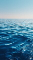 Fototapeta premium Azure Ocean Water Surface with Reflected Sunlight Sparkling in the Middle of the Day Clear Sky Reflecting on Gentle Wave Pattern Textured Seascape Scenic Serene Wide Angle