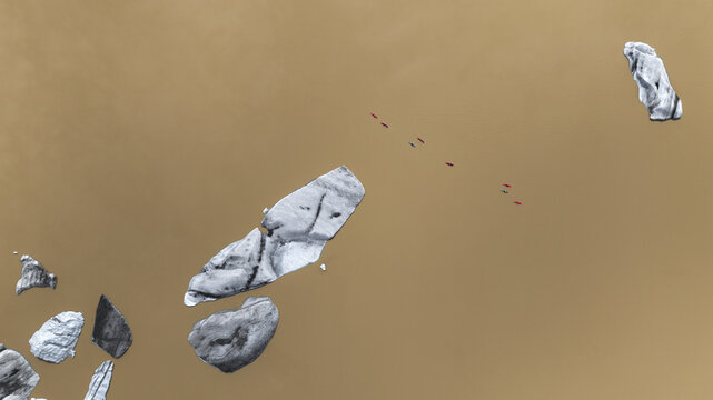 Aerial view of stark white ice formations scattered across a vast, desolate, ochre landscape, a silent testament to Iceland's raw beauty, Skaftafell, Sveitarfelagid Hornafjordur, Iceland.
