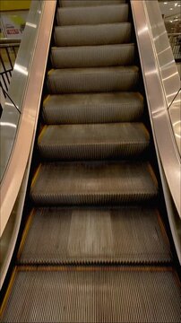 empty moving escalator moving down, mechanic electric Stair