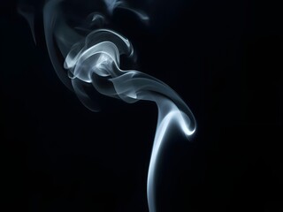Thin drifting smoke rising gently against a solid black backdrop.