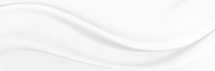 White gray satin texture that is white silver fabric silk panorama background with beautiful soft blur pattern natural.