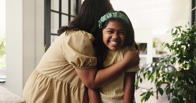 Happy, kiss cheek and mom with child in home for bonding, healthy relationship and affection on weekend. Family, parent and mother with girl embrace for connection, care and love in living room