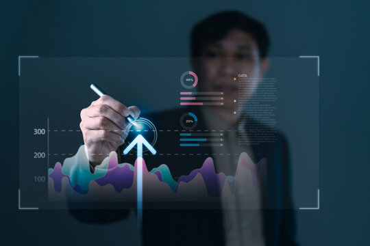 Data analytics and business growth strategy concept with businessman drawing upward arrow on digital graph interface