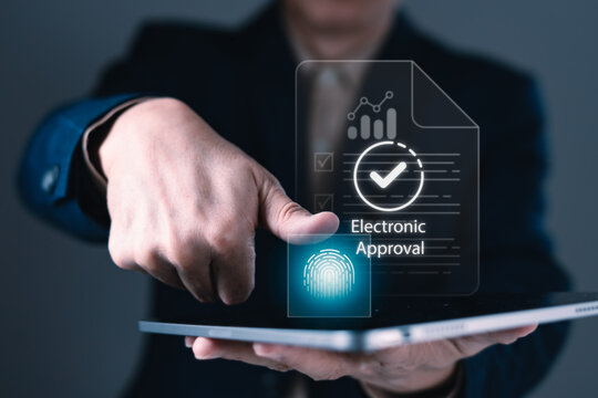 Businessman using fingerprint scan on tablet for electronic document approval, digital signature, and secure online verification process