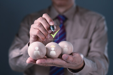 Businessman selecting best candidate with check mark and crown icon on wooden ball, HR recruitment and talent choice concept
