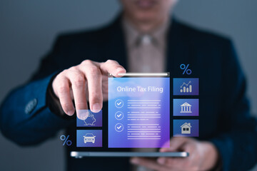 Businessman using digital interface for online tax filing with financial icons for savings, property, vehicle and banking